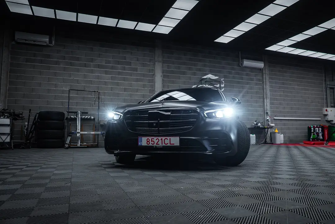 Black SUV parked in modern UAE villa garage with premium dark grey garage flooring