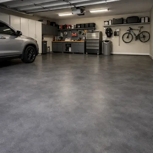 Smooth finish microcement garage flooring in luxury Palm Jumeirah villa with seamless joint-free finish