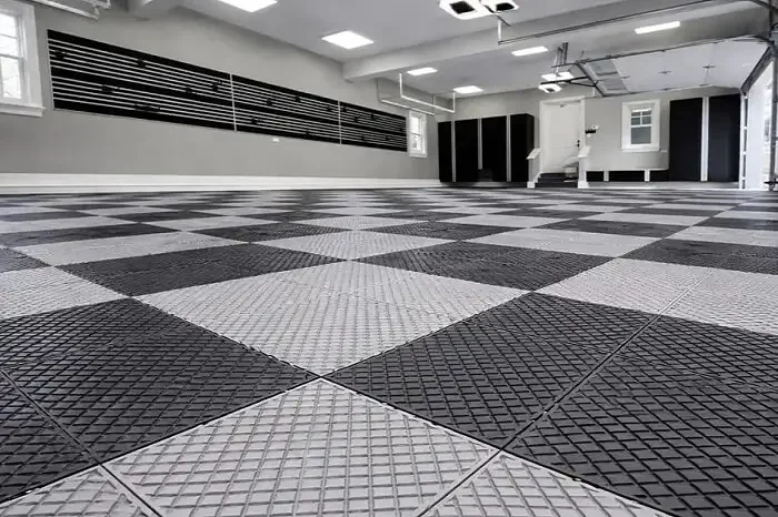 Black and grey interlocking garage flooring tiles installed in Dubai garage